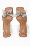 HEELED VINYL SANDALS WITH BOW